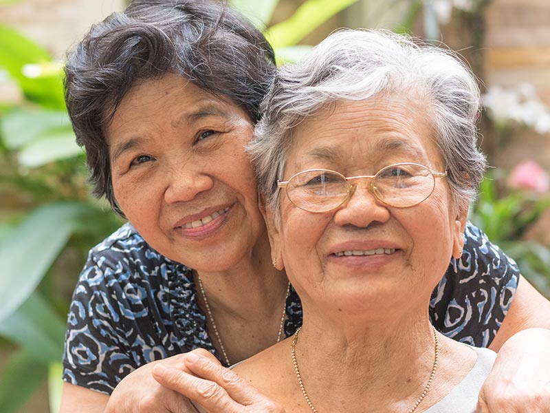 Two elderly women smiling